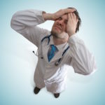 stressed doctor after making medical mistake