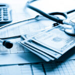 Health insurance application form with banknote and stethoscope concept for life planning